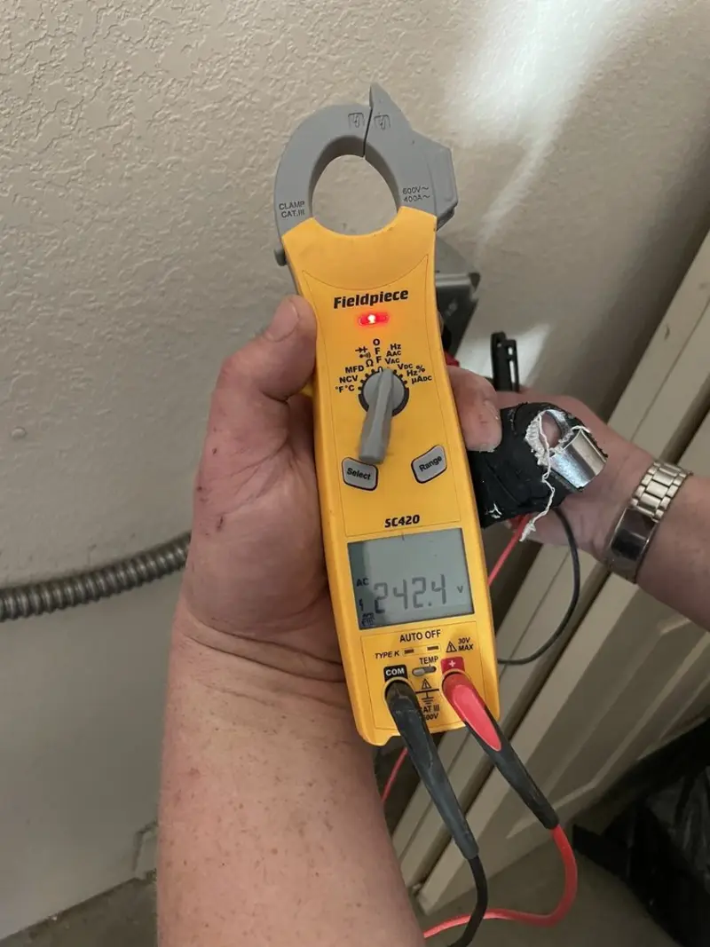 Voltage testing with clamp meter during Electrical Installation Services in Harbison Canyon
